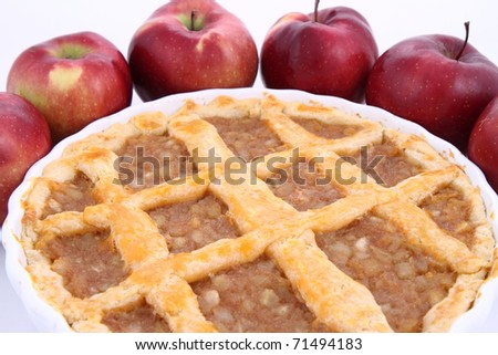 Apple Pie and some red apples on white background