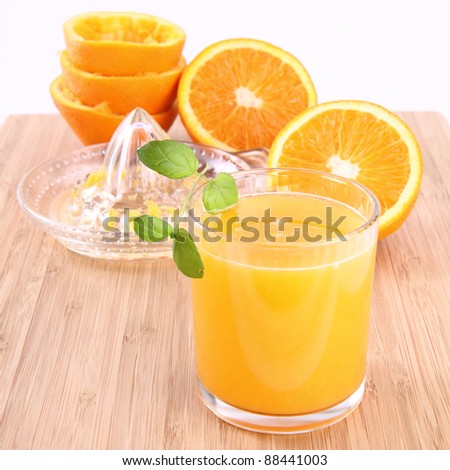 Orange juice freshly squeezed from fresh fruits with a juicer
