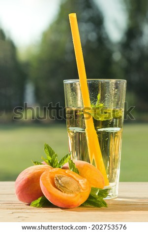 Healthy cold drink on wooden table in the garden