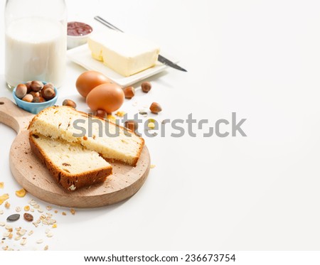 two slices of sweet  bread with strawberry  jam on a wooden board on table with copy-space
