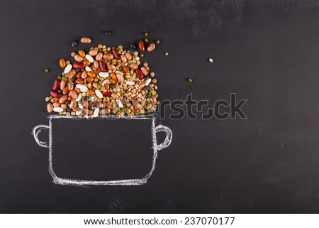 Drawn pot and real pulses on the chalkboard with copy-space