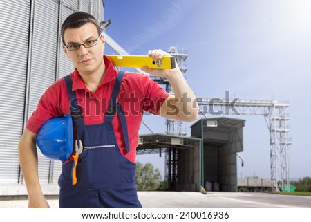 worker in front of silo company