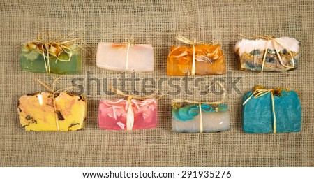 Colorful handmade soaps on jute