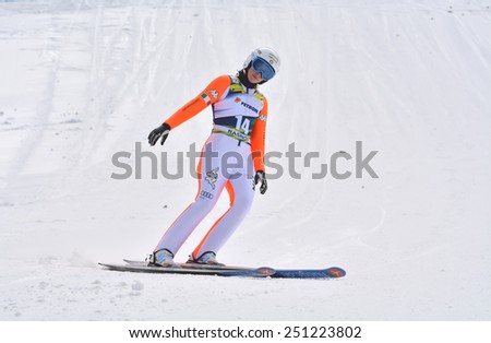 Rasnov, Romania - February 7: Unknown ski jumper competes in the FIS Ski Jumping World Cup Ladies on February 7, 2015 in Rasnov, Romania