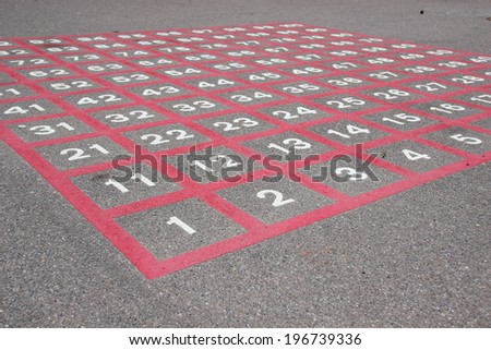 Matrix on asphalt with white numbers and red lines