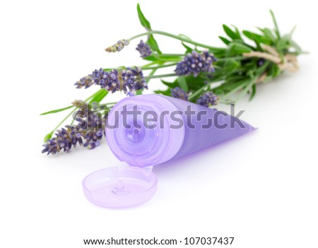 Lavender soothing cream tube and lavender flower, isolated on white background