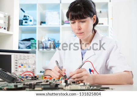 Girl debugging an electronic precision device