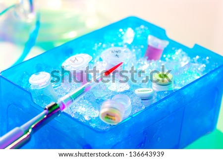 Automatic pipette over reaction tube in a box full of ice