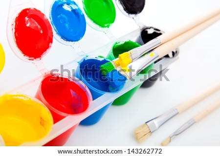 Water based paints and brush, isolated on a white background