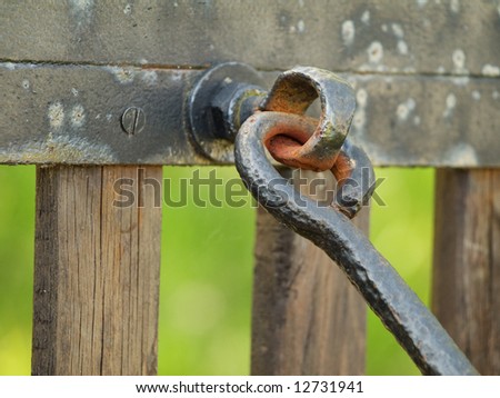 Old fence with  metal hook
