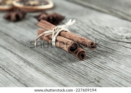 Cinnamon sticks, close up on wooden table