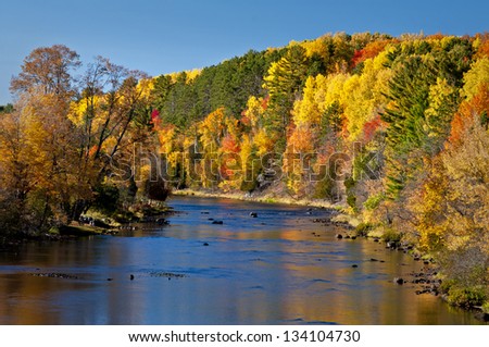 Autumn on the Paint River Autumn colors are reflected in the surface of the Paint River in Michigan\'s Upper Peninsula.