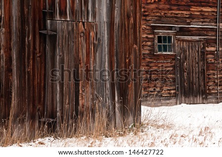 Barn doors in an old weathered barn on an abandon cherry orchard in Door County, Wisconsin.