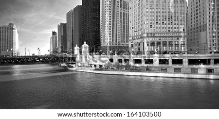 Architecture on a grand scale lines the Chicago River where it flows beneath the DuSable Bridge.