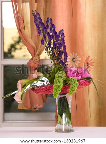 Beautiful lavender , pink and green flowers bouquet in a vase