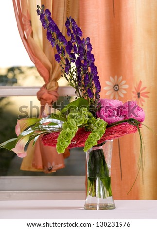 Beautiful lavender , pink and green flowers bouquet in a vase