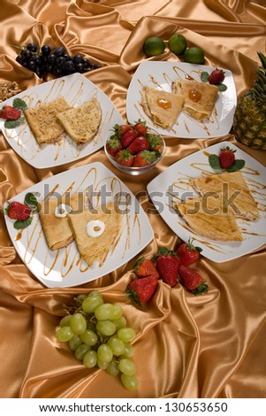 Different types of food plate\'s isolated on a orange background