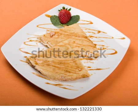 Different types of food plates and soup isolated on orange background