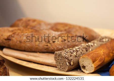 Different types of bread, cakes and pastry on table