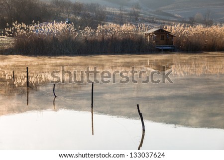 Spring morning foggy lake house and landscapes