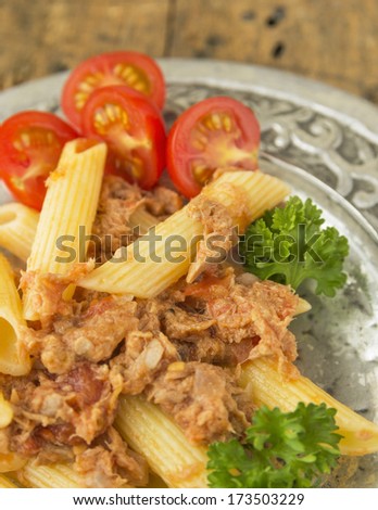 Tuna pasta with tomatoes  in silver plate