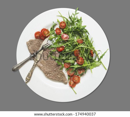 dietetic food, beef with rocket salad and tomatoes , isolated on gray