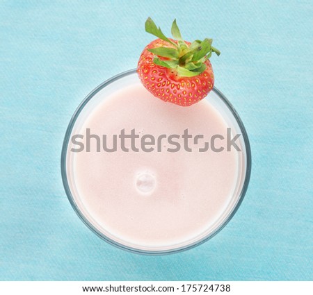 strawberry pink milk shake on  blue turquoise, top view