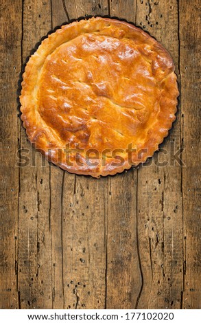 Tart,cake,pie, base  in baking dish on old wood board