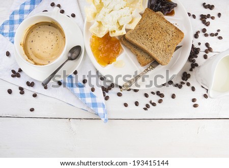 breakfast with coffee and toast on white wooden table , top view, copy space