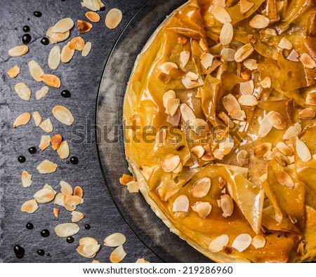 phyllo dough cake with rose water syrup and almonds, top view