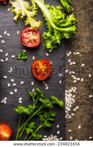 Tomato, lettuce, greens and rice, dieting food background, top view