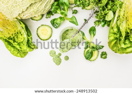 Yogurt smoothie  with green vegetables , food background, top view, frame