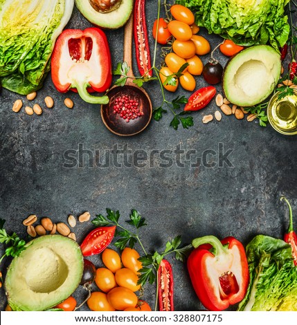 Fresh Colorful Vegetables ingredients for tasty vegan and  healthy cooking or salad making on rustic background, top view, frame. Diet food concept.