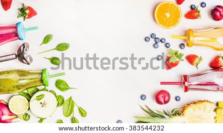 Healthy lifestyle background with various colorful smoothie drinks in bottles, blender and ingredients on white wooden. Detox and diet food concept.
