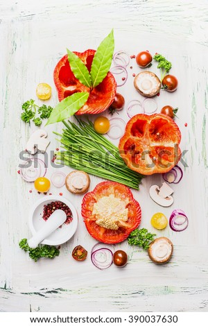 Fresh Paprika vegetables and ingredient  for cooking on white rustic background, top view. Healthy and clean eating concept.