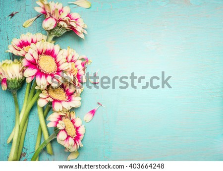 Lovely flowers on turquoise shabby chic background. Festive greeting card