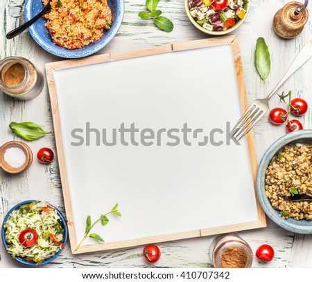 Various healthy vegetarian salads bowls around blank white chalkboard, top view. Salad bar. Food background for menu, recipes or your text