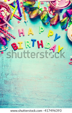 Happy birthday greeting card with party tools ,drinks and  confetti on turquoise shabby chic background, top view place for text, border, vertical