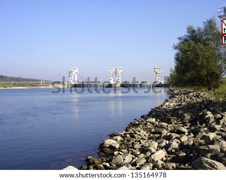 DRIEL, THE NETHERLANDS - OCTOBER 22: Stuw Driel, the weir in the river Rhine (Nederrijn), with closed bows controls water levels of the river delta on october 22, 2007 in Driel, the Netherlands.