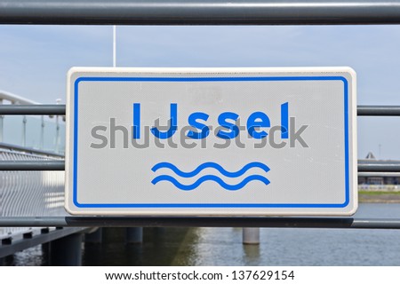 Road sign of the river IJssel on the quay at Kampen, the Netherlands on april 24, 2010
