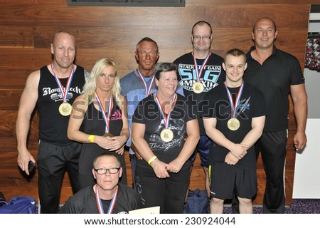 ROOSENDAAL, THE NETHERLANDS - OCTOBER 19, 2014. Contestants showing their medals and trophy\'s of the World and National record titles at the Walter\'s Open Dutch Championship Cheating Curl.