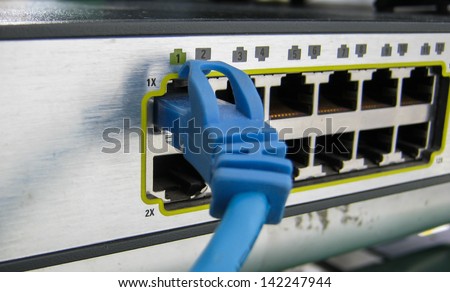 Ethernet RJ45 cables are connected to internet switch on business server network