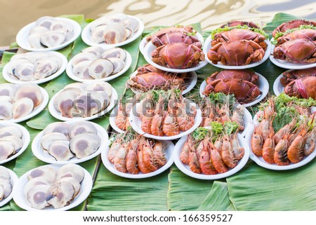 Shrimp, crab and clams on the plate