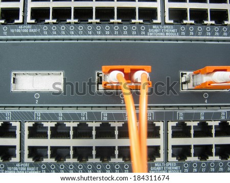GBIC fiber optic communications switch equipment installed in large data center.