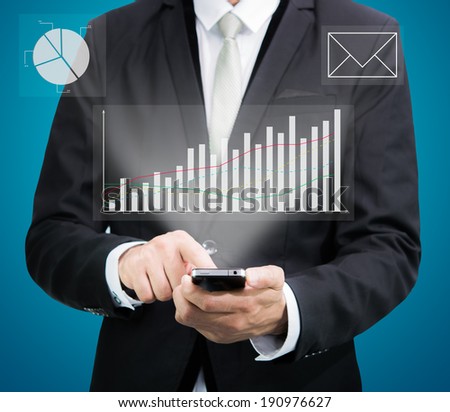Businessman standing posture hand hold mobile phone analyze graph isolated on blue background