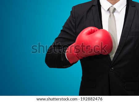Businessman standing posture in boxing gloves isolated on over blue background
