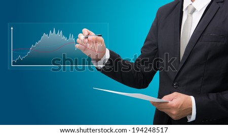 Businessman standing posture hand hold a pen isolated on blue background