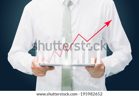 Businessman standing posture hand graph on tablet isolated on dark background