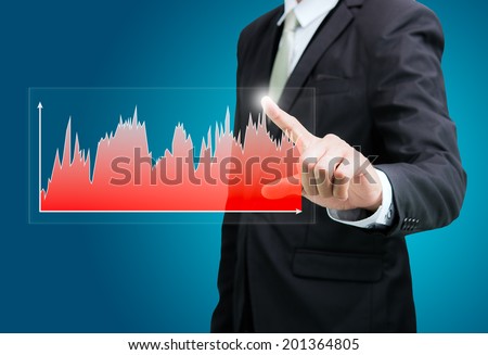 Businessman standing posture hand touch graph finance isolated on over blue background