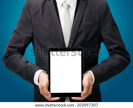 Businessman standing posture hand holding blank tablet isolated on blue background